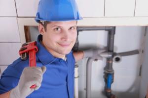 Gene poses with a pipe wrench