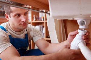 a service tech installs a sink drain line we do everything from toilet repairs to new drain lines