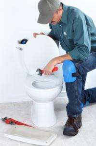 Plumber in Dale City VA repairs a toilet